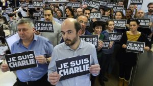 The newsroom at Agence France Presse reacts to yesterday's attack on the office of Charlie Hebdo (Bertrand Guay/AFP/Getty, via)