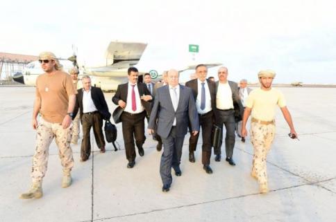 Handout photo of Yemen's exiled President Abd-Rabbu Mansour Hadi walking at Aden airport upon his arrival from Saudi Arabia